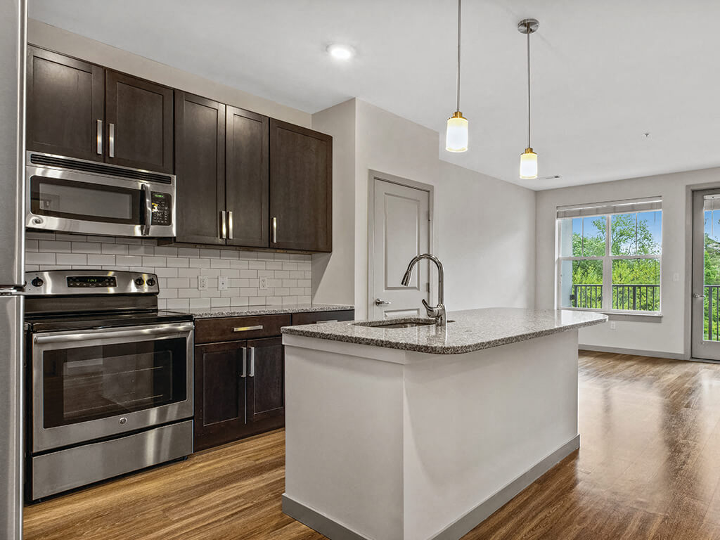 A bright kitchen with an island at the Slate at Andover Apartments in Andover, Massachusetts.